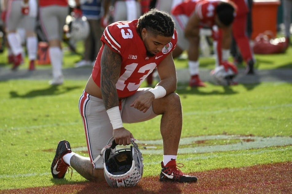 Gee Scott Jr. takes a knee prior to the Rose Bowl game against the Utah Utes.