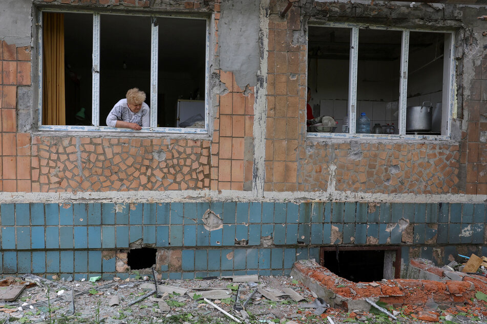 Ukraine's residents have dealt with the aftermath of Russia's destructive invasion, including at an apartment building (pictured) in Donetsk, Ukraine after recent shelling.