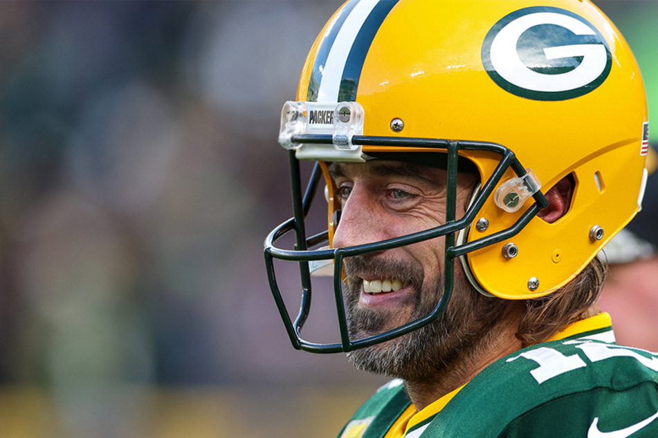 Green Bay Packers quarterback Aaron Rodgers flashes a smile during a game between the Seattle Seahawks and the Green Bay Packers at Lambeau Field.