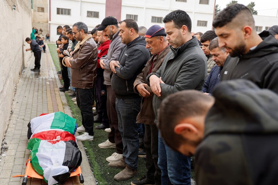 At least 12 Palestinians have been killed and dozens more injured in Israeli attacks