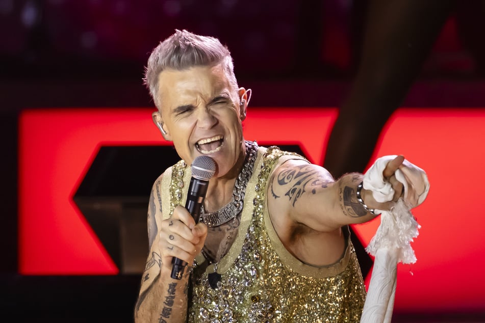 Superstar Robbie Williams (50) performt seine alten und neuen Hits im Juli in der Berliner Waldbühne.