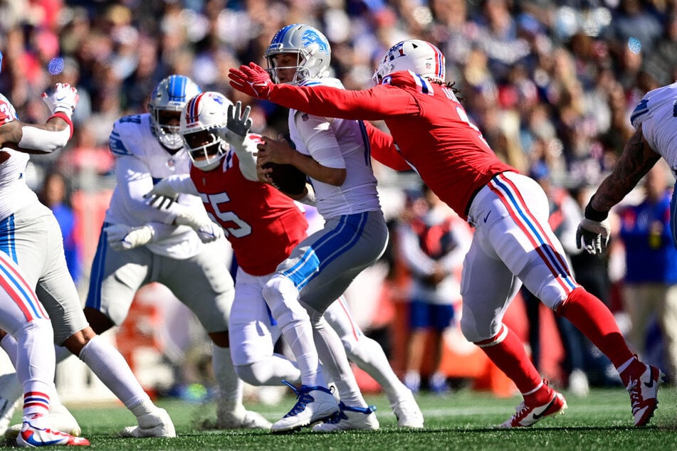 Nach mehr als vier Jahren treffen die New England Patriots (in Rot) 2026 wieder auf die Detroit Lions - dann in der Münchner Allianz-Arena. (Archiv)