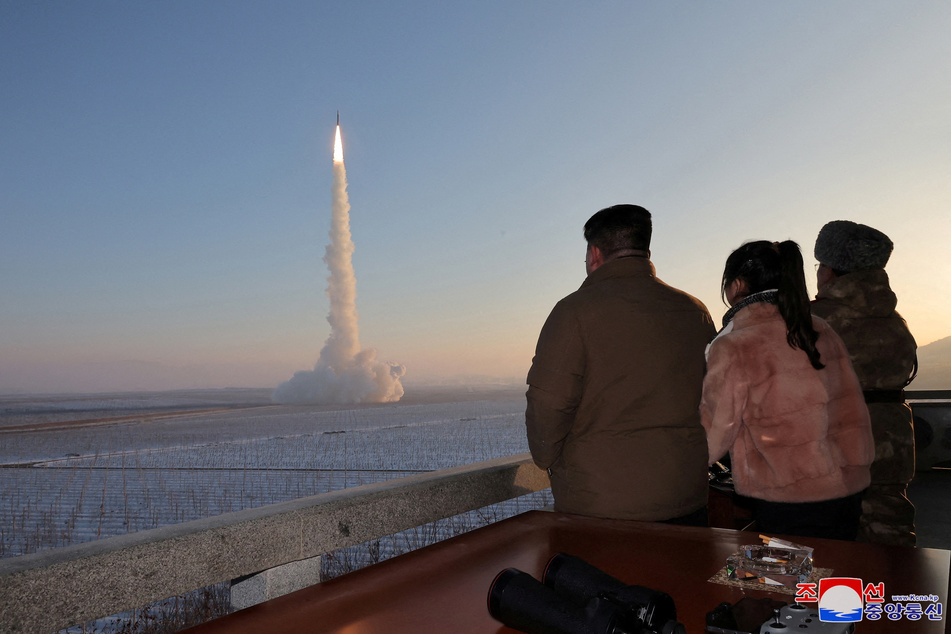 North Korean leader Kim Jong Un views the launch of a Hwasong-18 intercontinental ballistic missile on December 18, 2023.