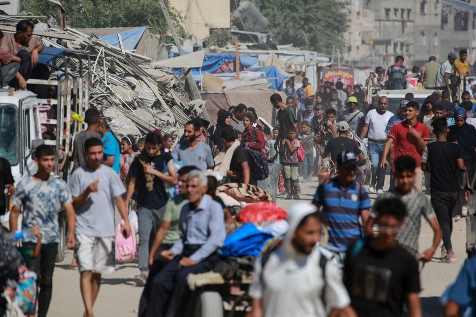 Displaced Palestinians leave an area in east Khan Younis as Israel prepares to launch a new military operation.