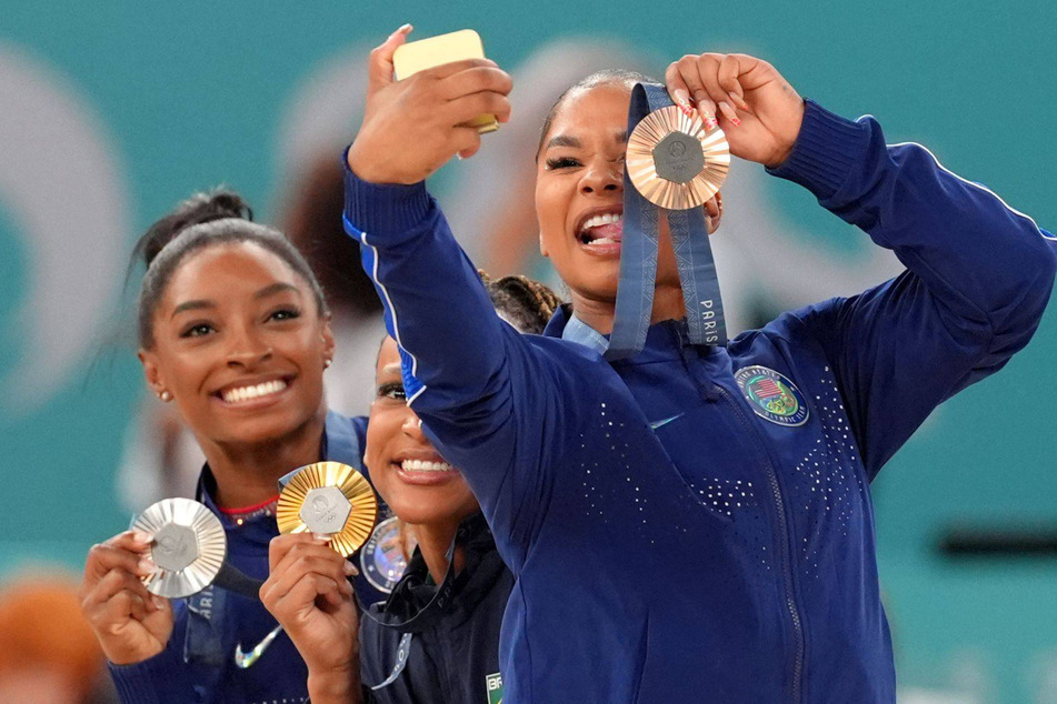 Jordan Chiles (r.) was awarded the bronze medal following a score revision in the floor exercise final before Romania accused Team USA of making the score appeal too late.