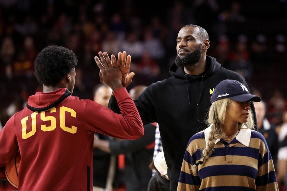 LeBron James (r) unapologetically embraced his role as a dad first and an NBA star second after his NBA game against Dallas to support his son Bronny.