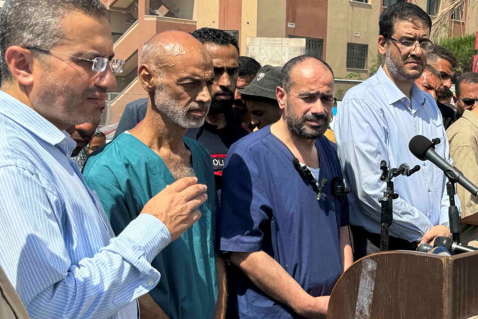 Al-Shifa hospital director Mohammed Abu Salmiya (2nd from r.), who was released after months of Israeli detention, reported being tortured in prison.