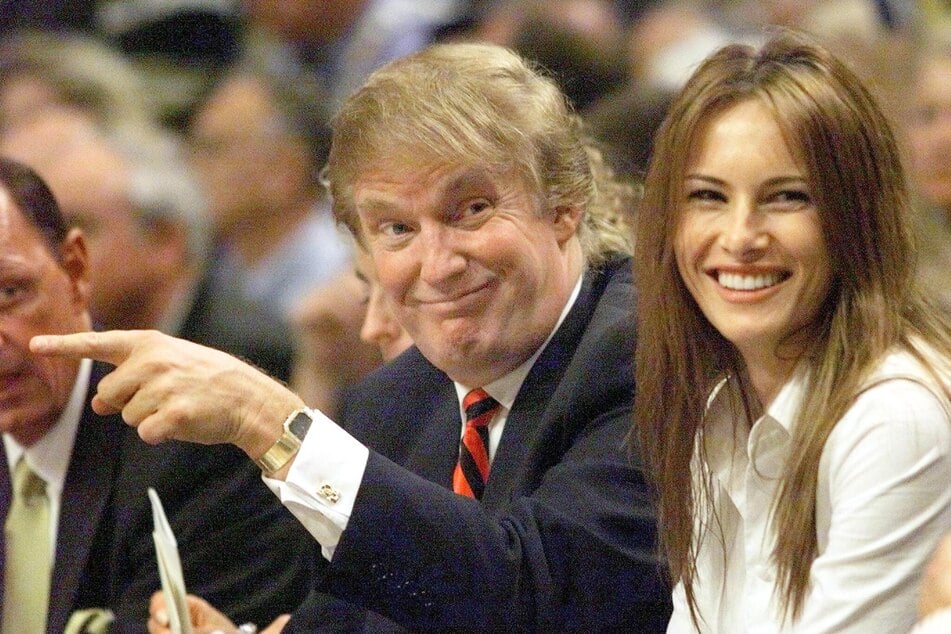 A young Donald Trump (c.) attending a basketball game with his then-girlfriend, Melania Knauss, in Indianapolis, Indiana on June 01, 1999.