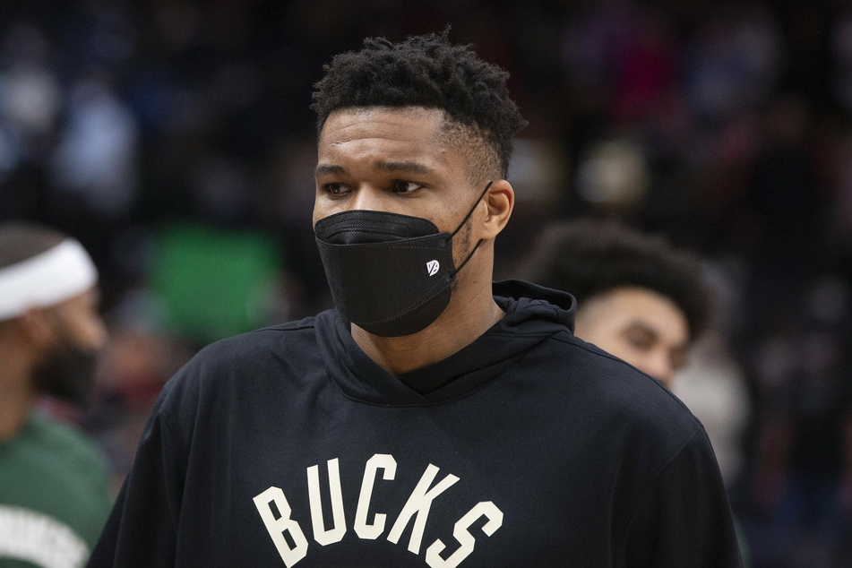 The Milwaukee Bucks' Giannis Antetokounmpo leaves the court after sitting out his team's loss to Toronto Raptors.