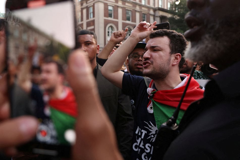 Mahmoud Khalil leads a march for Palestinian liberation after speaking at a rally to welcome him home.