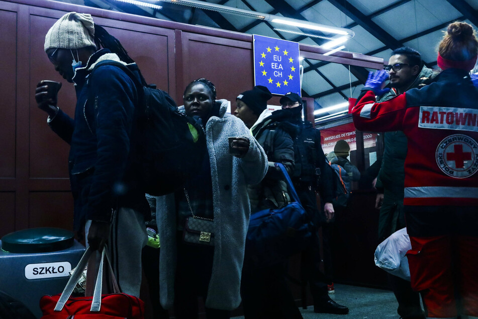 Black refugees fleeing Ukraine arrive at a Polish train station.