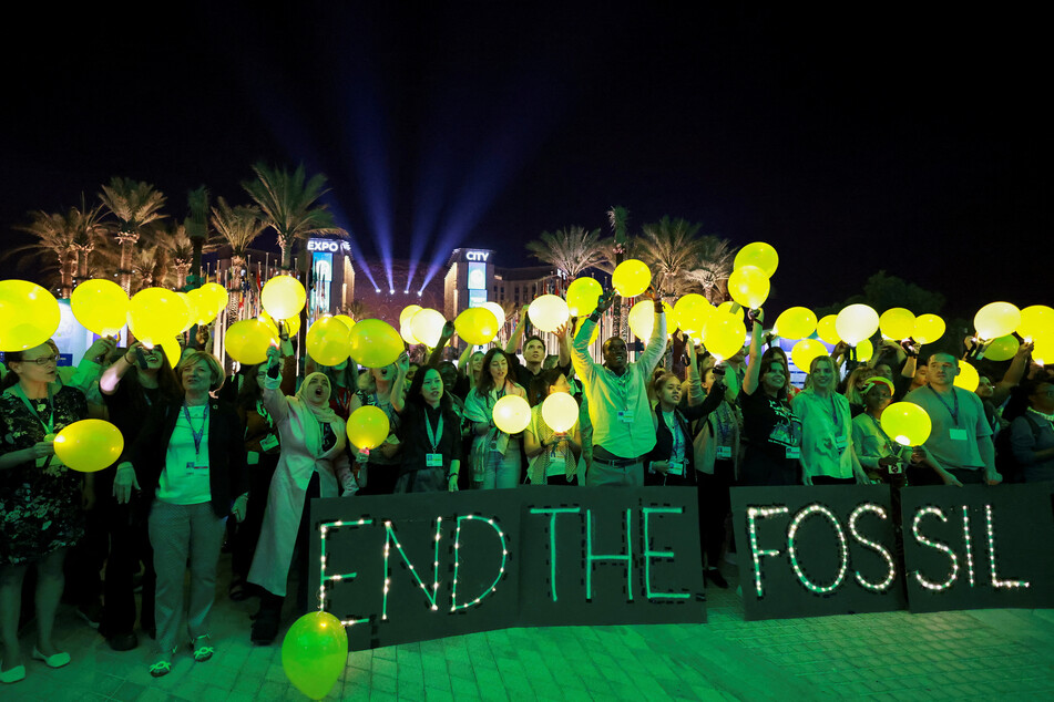 Activists attend a protest calling for an end to fossil fuels at the United Nations Climate Change Conference (COP28) in Dubai, United Arab Emirates.