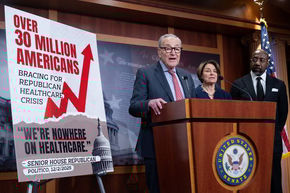 Senate Minority Leader Chuck Schumer, Democrat of New York, speaks alongside Senator Amy Klobuchar (2nd R), Democrat of Minnesota, and Senator Raphael Warnock (R), Democrat of Georgia, following a failed vote in the US Senate over healthcare subsidies on Thursday.