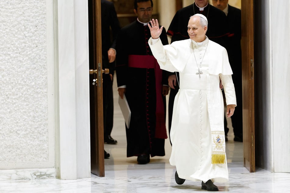 Pope Leo XIV waves as he arrives to hold an audience with members of the Italian Association of Scouts and Catholic Scouts of Europe at the Paul VI hall at the Vatican on June 1, 2026.