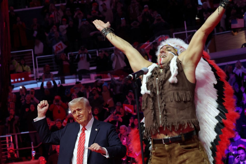 President-elect Donald Trump dances as the Village People perform during a rally the day before he is scheduled to be inaugurated for a second term, in Washington DC on January 19, 2025.