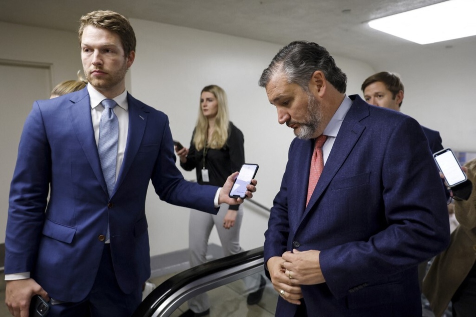 Texas Sen. Ted Cruz (r.) walks through the Senate subway to participate in a vote on the same-sex and interracial marriage bill.