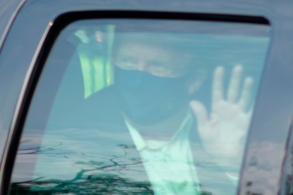 Donald Trump left the hospital to wave to his supporters.