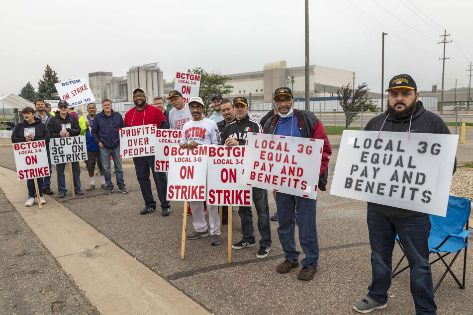 Members of the Bakery, Confectionery, Tobacco Workers and Grain Millers International Union in Battle Creek, Michigan, have been on strike for more than three weeks demanding better labor conditions at Kellogg plants.