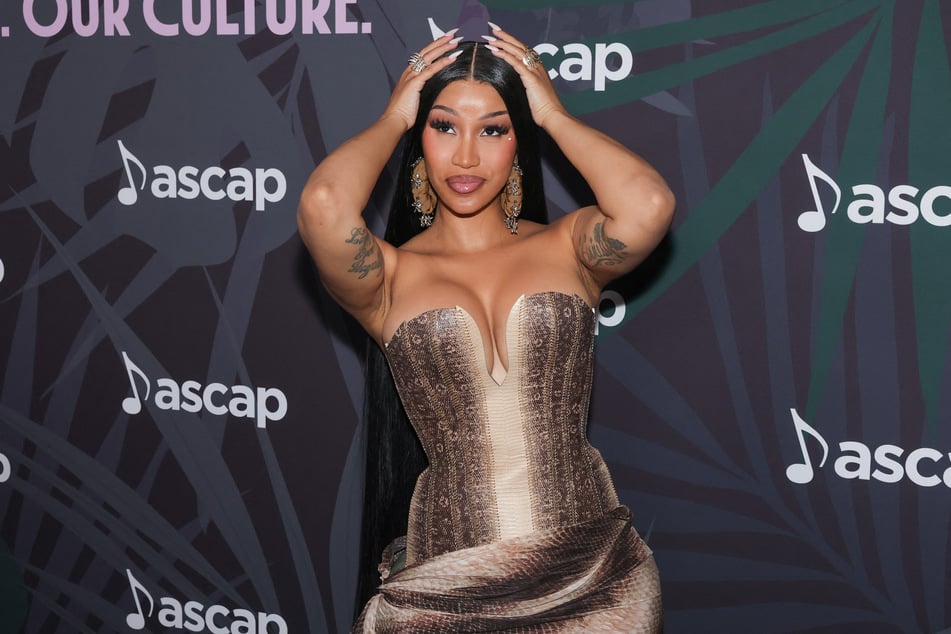 Rapper Cardi B is serving supreme meme game to promote her latest album and celebrate her recent court victory in one move.