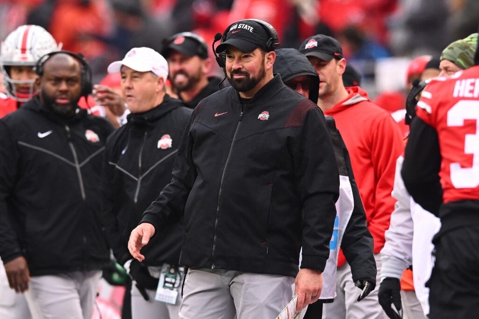 Replacing Tony Alford won't be easy, but head coach Ryan Day (c.) has shown a knack for making bold moves on his coaching staff.