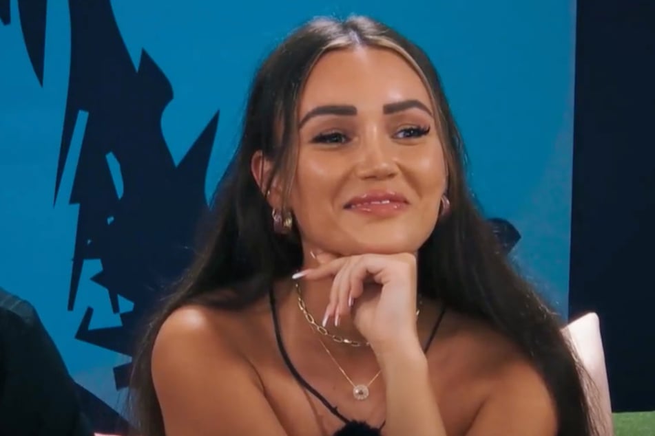 Dana (27) tries to smile away her anger about the exit.