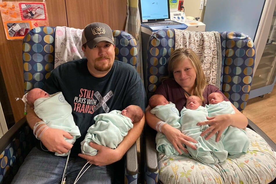 Joshua and Megan Hulen with their quintuplets.