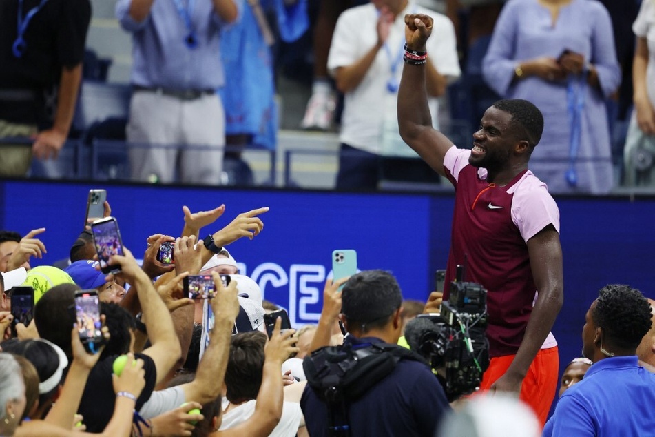 Frances Tiafoe celebrates his win against Rafael Nadal that advanced him to the quarterfinals of the 2022 US Open.