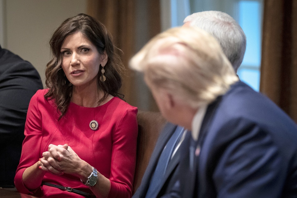 South Dakota Governor Kristi Noem speaking with then-President Donald Trump at the White House on December 16, 2019.