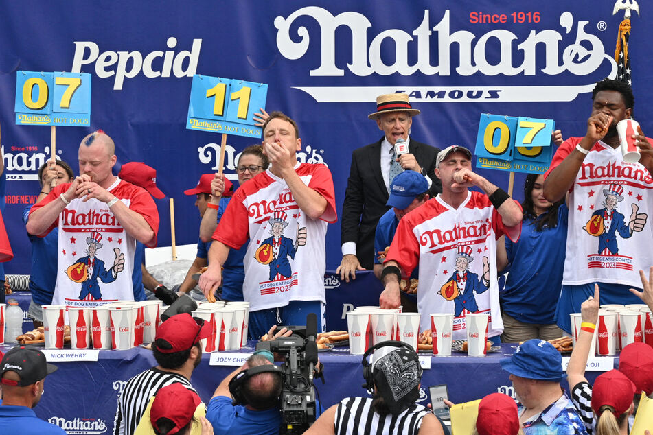 Joey Chestnut (2nd from l.) won Nathan's Famous Hot Dog Eating Contest for the 16th time!