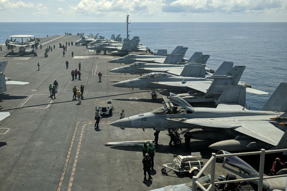 The USS Ronald Reagan aircraft carrier sails in the South China Sea.