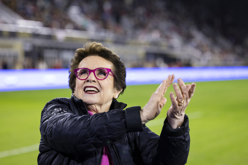 Billie Jean King claps to fans before the start of the 2022 National Women's Soccer League Championship between Portland Thorns FC and Kansas City Current at Audi Field on October 29, 2022.