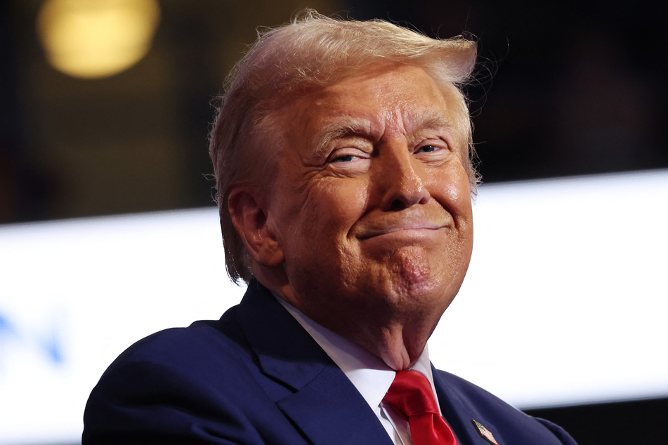 Donald Trump (pictured) launched fresh personal attacks against White House rival Kamala Harris on Saturday, as new polling showed her making major gains in key battleground states.