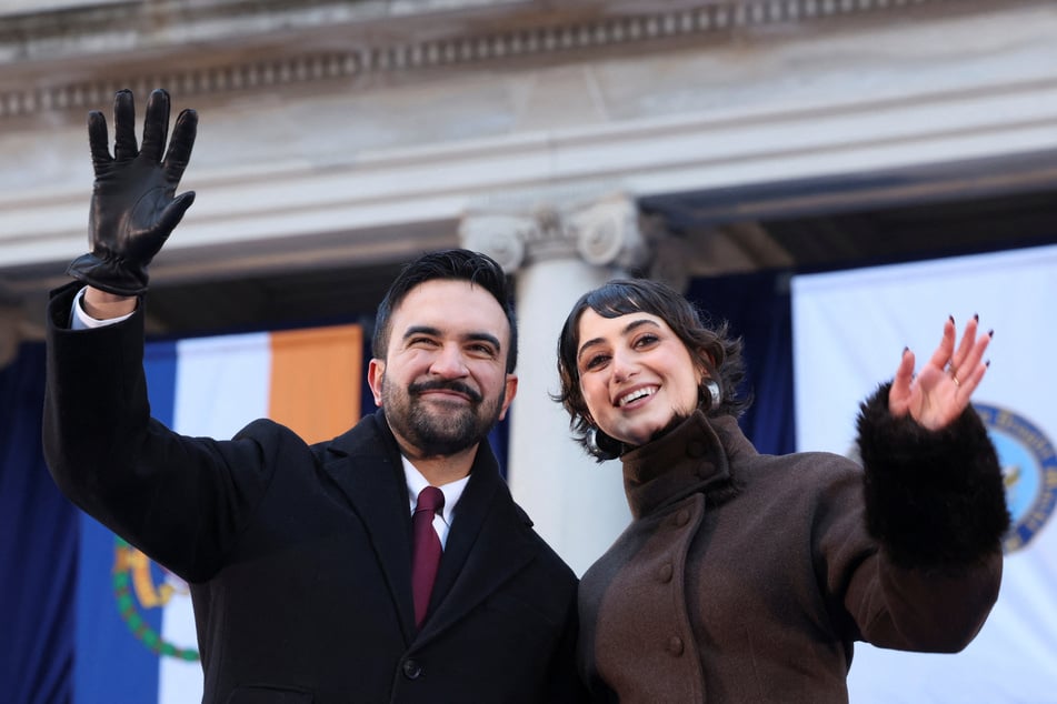 New York City Mayor Zohran Mamdani (l.) and his wife Rama Duwaji wave to the crowd after his public inauguration ceremony on January 1, 2026.