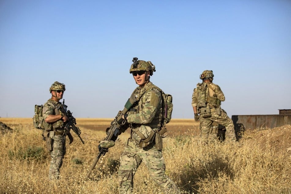 US troops patrol near an oil field in al-Qahtaniyah in Syria's northeastern Hasakah province.