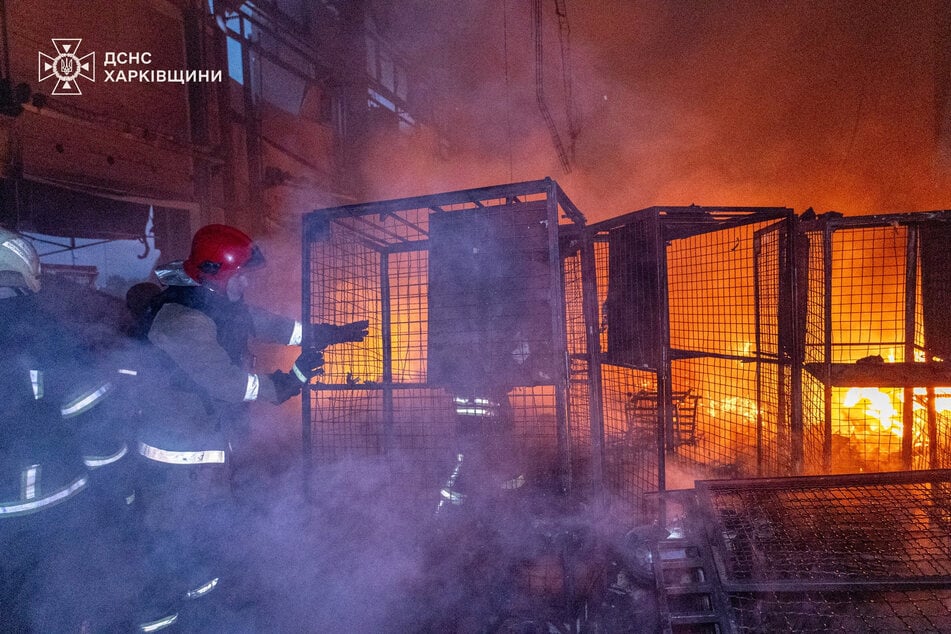 Firefighters work at a terminal of a private postal company, the site of a Russian drone strike, in Odesa, Ukraine, on June 3, 2025.