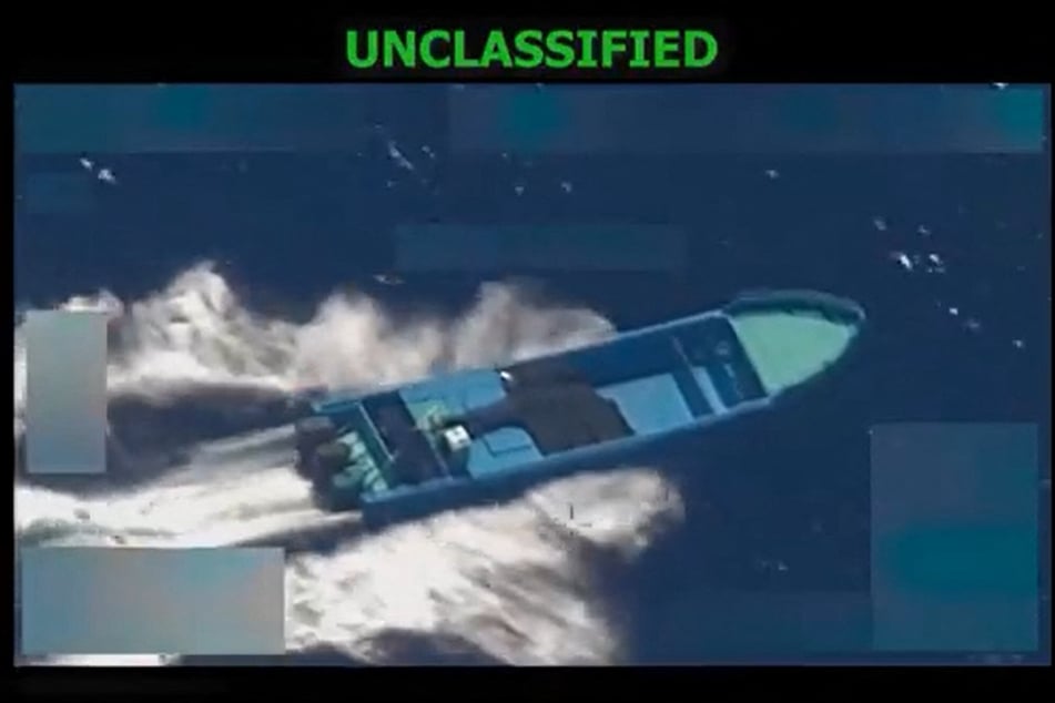 This screen grab from a video posted by US Defense Secretary Pete Hegseth on his X account shows US military forces conducting a strike on a vessel in the Eastern Pacific Ocean on October 21, 2025.