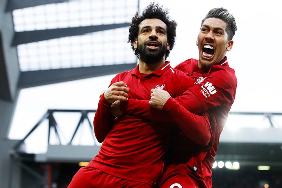 Können Liverpools Sturmstars Mohamed Salah (l.) und Roberto Firmino am Ende der Saison die Meisterschaft feiern?