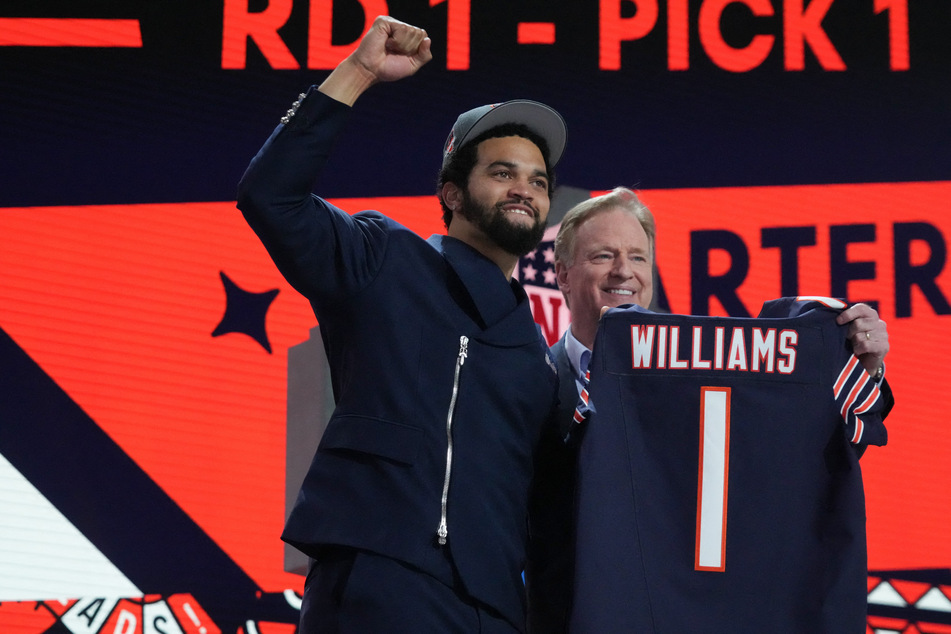 Southern California Trojans quarterback Caleb Williams poses with NFL commissioner Roger Goodell after being selected by the Chicago Bears as the No. 1 pick in the first round of the 2024 NFL Draft.