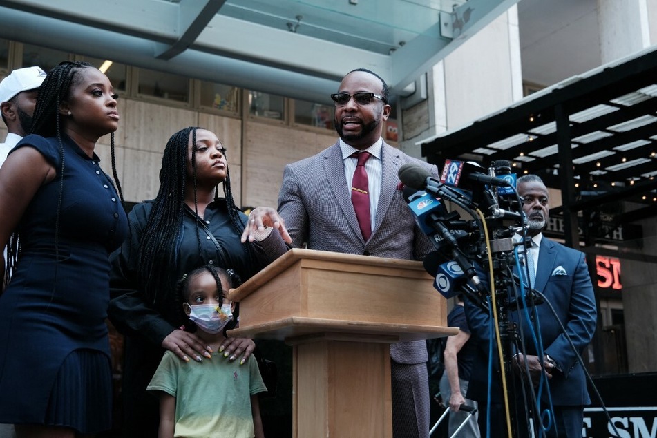 Lawyer B'Ivory LaMarr (c.), who represents the family of the two young girls at the center of the Sesame Place racism scandal, speaking at a press conference in New York on July 20.