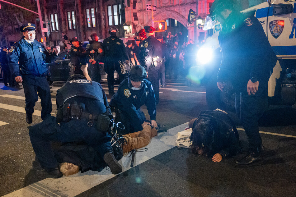 Cops arrested scores of protesters and tore down a Palestinian flag on campus, replacing it with a US one.