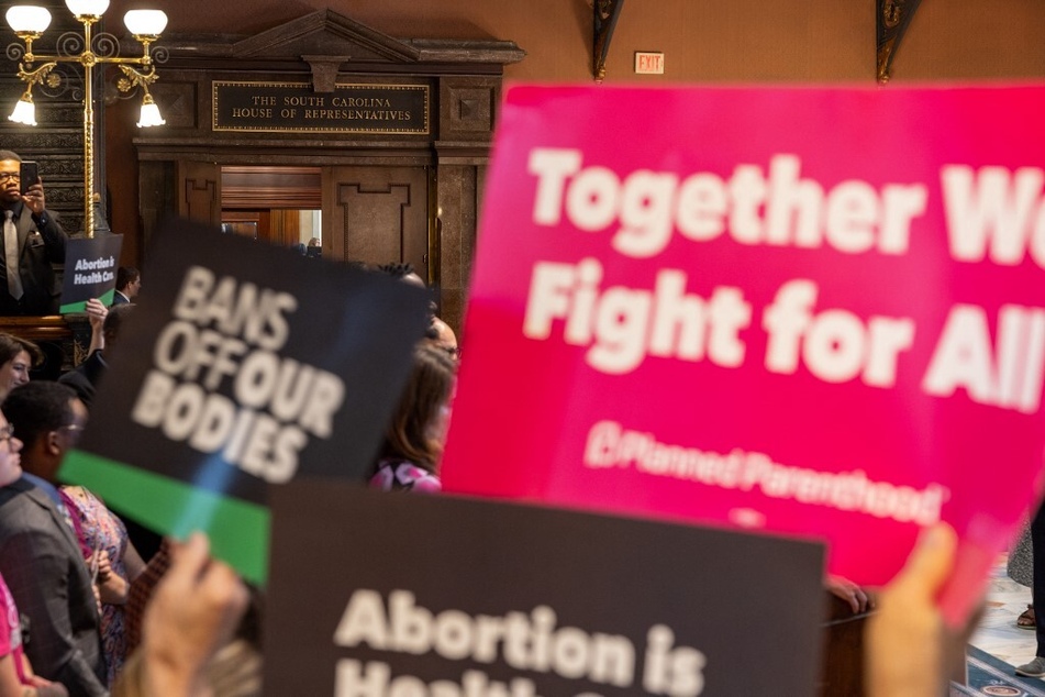 Pro-choice protesters rally outside the South Carolina state House before debate of a bill that would restrict abortions after six weeks.