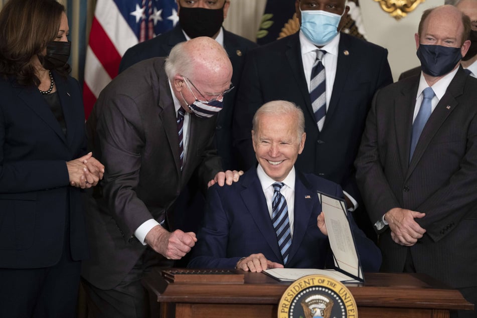 Biden signing the three new bills into law at the White House on Thursday.