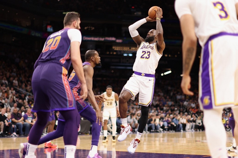 LeBron James' (c.) presence could elevate the Phoenix Suns to serious championship contenders with his veteran leadership.