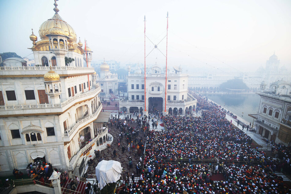 People waited in crowds to pray at the Golden Temple on New Year's Day in Amritsar, India.