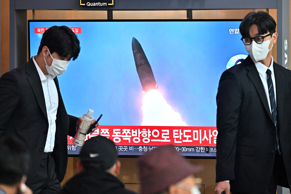 Spectators looked on as North Korea fired a mid-range ballistic missile on Tuesday, which flew over Japan and was shown on TV.