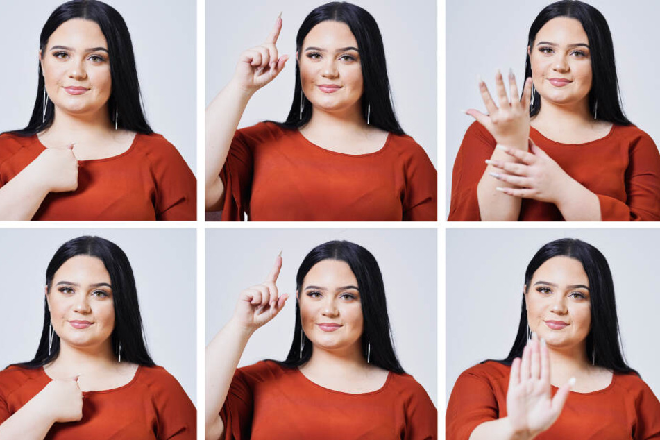 Vanessa Feller-Jung zeigt in Gebärdensprache die Zeilen "Ich glaube an Wunder" und "Ich glaube an dich" aus einem Rap-Song ihres Musiker-Kollegen Siga.