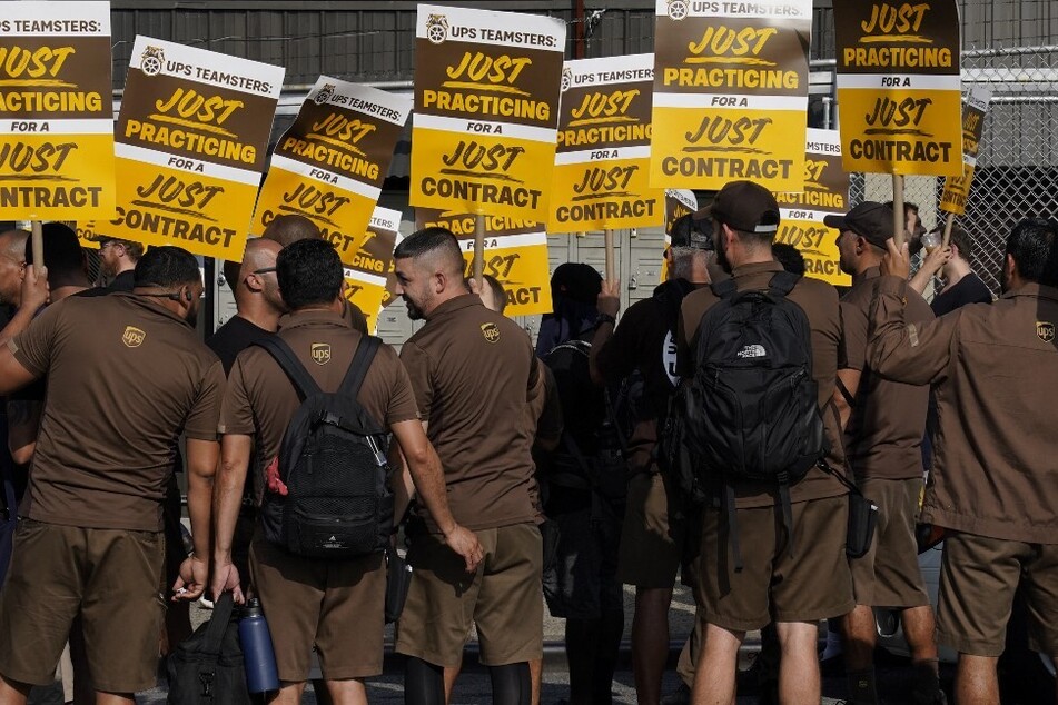 UPS workers walk a practice picket line on July 7, 2023, in the Queens borough of New York City.
