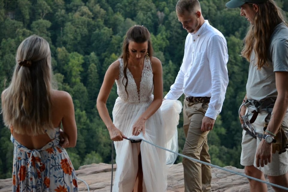 Under control: the bride was wearing a safety harness the whole time.