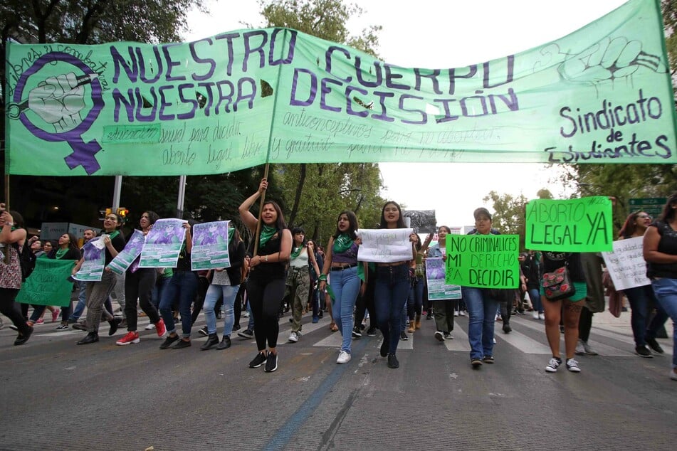 Pro-choice protesters rally in Mexico City to demand the legalization of an abortion across the country.