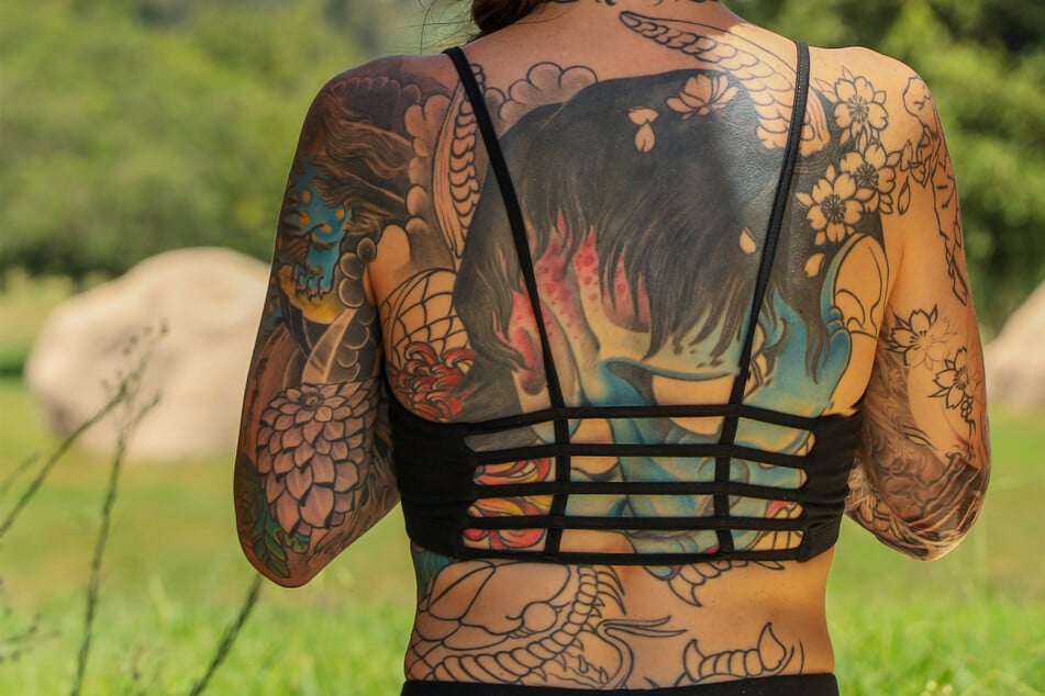 Teacher covers 85% of body in radical "living memoir" tattoos